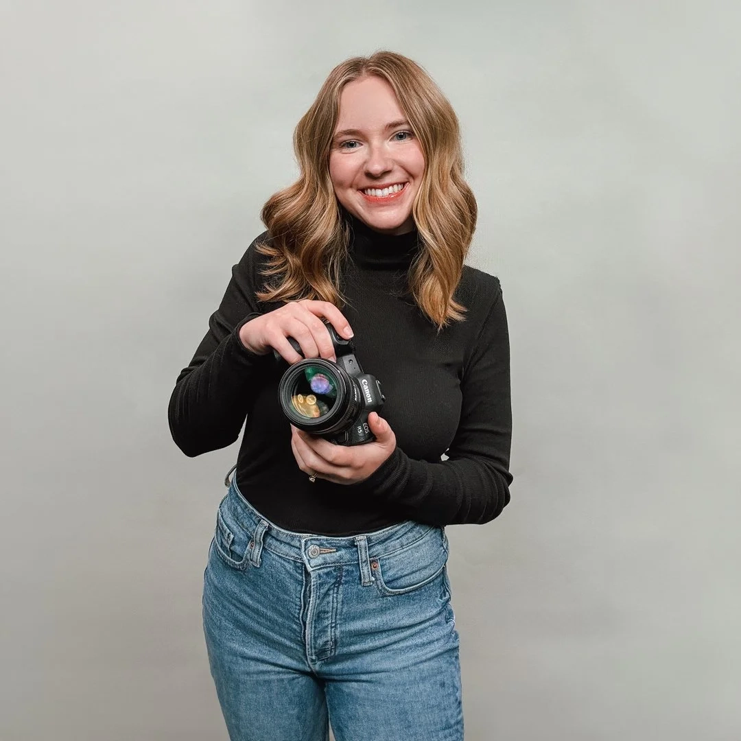 Caroline Gibson holding a camera